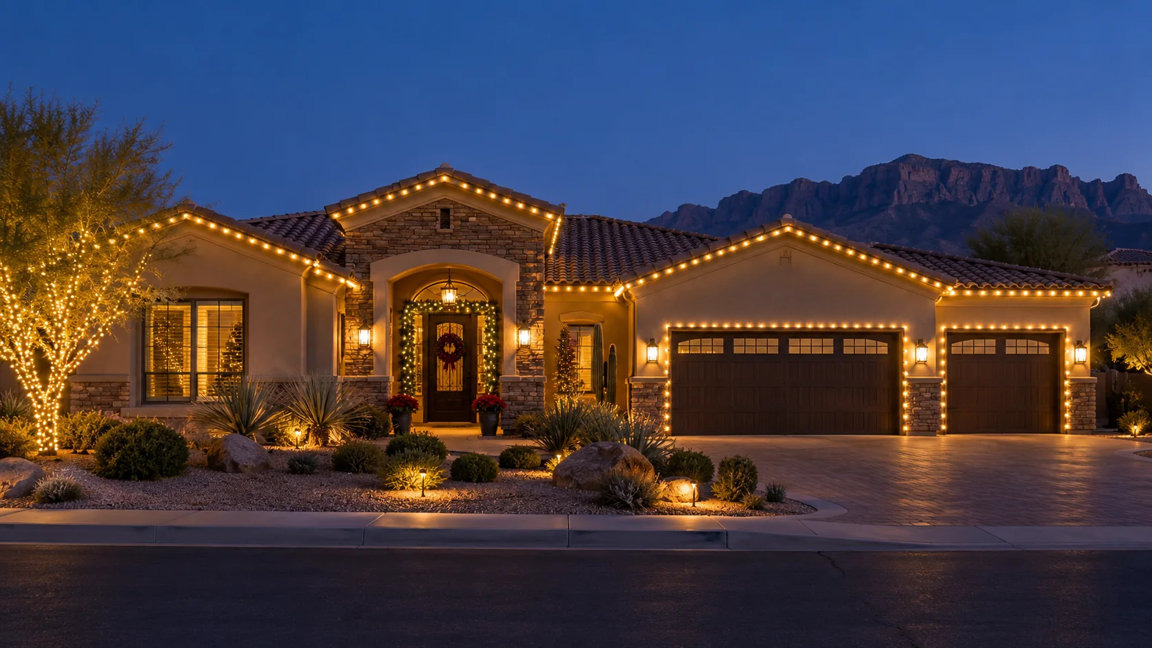 Professional warm white C9 Christmas lights installed along the roofline of an Arizona home